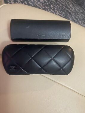 CHANEL Black Quilted Leather Cosmetic/Eyewear Case with CC Logo plus Prada case